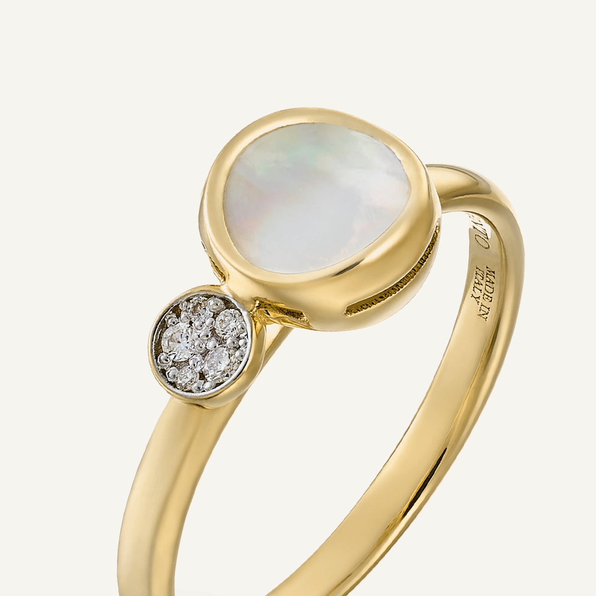 Gold ring with mother of pearl and diamonds